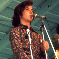 Courtney Johnson and Sam Bush (New Grass Revival) and Fred Bartenstein, Watermelon Park, Berryville, VA. July 1973. (Photo: Albert Ihde)