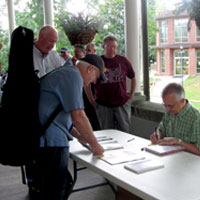 
Fred Bartenstein signs copies of The Bluegrass Hall of Fame at Augusta Heritage Center’s Bluegrass Week, Elkins, WV, July, 2015. (Photo: Donald Wermuth)